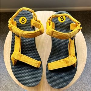Brand new without tags. Never worn. Mustard colored Tevas